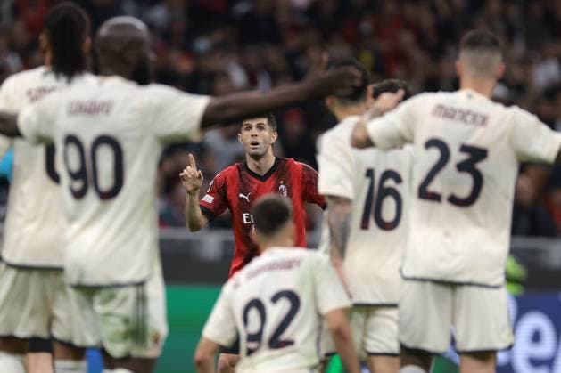 Milan, Italy, 11th April 2024. Christian Pulisic of AC Milan reacts as he is shown a yellow. card by the Referee Clement Turpin of France during the UEFA Europa League match at Giuseppe Meazza, Milan. Picture credit should read: Jonathan Moscrop Sportimage EDITORIAL USE ONLY. No use with unauthorised audio, video, data, fixture lists, club league logos or live services. Online in-match use limited to 120 images, no video emulation. No use in betting, games or single club league player publications. SPI-3069-0017