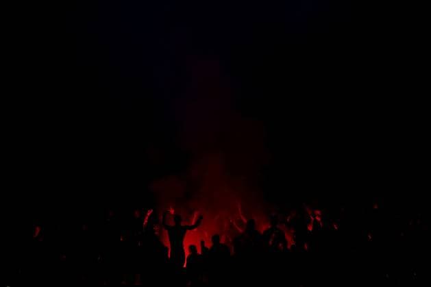 Milan, Italy, 11th April 2024. AC Milan fans cheer on their team as they light flares during the UEFA Europa League match at Giuseppe Meazza, Milan. Picture credit should read: Jonathan Moscrop Sportimage EDITORIAL USE ONLY. No use with unauthorised audio, video, data, fixture lists, club league logos or live services. Online in-match use limited to 120 images, no video emulation. No use in betting, games or single club league player publications. SPI-3069-0046