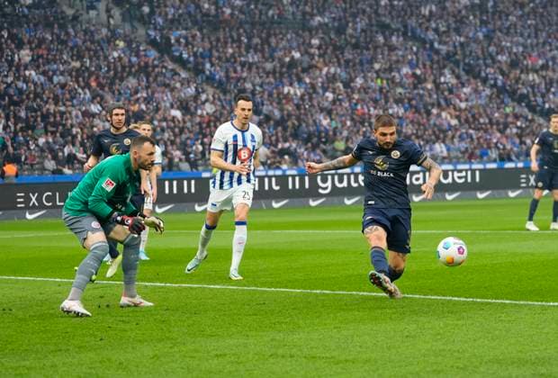 Germany, Berlin, 12.04.2024, Olympic Stadium, Hertha BSC vs FC Hansa Rostock - 2. Bundesliga, Konstantinos Stafylidis (FC Hansa Rostock) controls the ball Berlin Olympic Stadium Berlin Germany