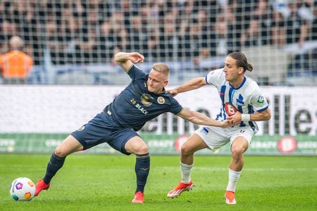 2. Fußball Bundesliga, Hertha BSC vs Hansa Rostock; Berlin, 12.04.2024 Kai Pröger (FC Hansa Rostock, 9), Michal Karbownik (Hertha BSC, 6) 2. Fußball Bundesliga, Hertha BSC vs Hansa Rostock, Olympiastadion, Berlin, 12.04.2024 DFL REGULATIONS PROHIBIT ANY USE OF PHOTOGRAPHS AS IMAGE SEQUENCES AND OR QUASI-VIDEO.