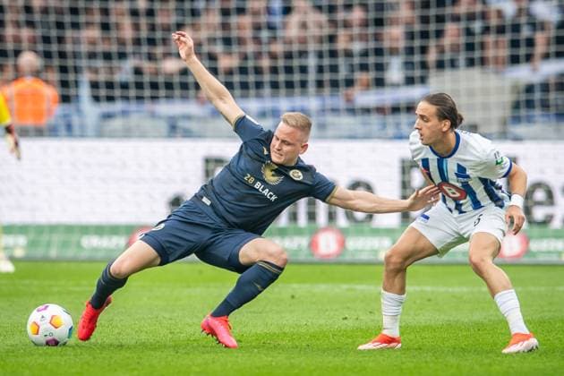 2. Fußball Bundesliga, Hertha BSC vs Hansa Rostock; Berlin, 12.04.2024 Kai Pröger (FC Hansa Rostock, 9), Michal Karbownik (Hertha BSC, 6) 2. Fußball Bundesliga, Hertha BSC vs Hansa Rostock, Olympiastadion, Berlin, 12.04.2024 DFL REGULATIONS PROHIBIT ANY USE OF PHOTOGRAPHS AS IMAGE SEQUENCES AND OR QUASI-VIDEO.