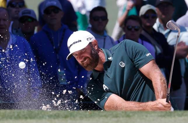 Dustin Johnson hits out of a bunker on the seventh hole in the second round of the Masters Tournament at Augusta National Golf Club in Augusta, Georgia on Friday, April 12, 2024.  AUG20240412539 TANNENxMAURY