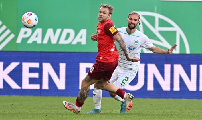12.04.2024 - Fussball - Saison 2023 2024 - 2. Fussball - Bundesliga - 29. Spieltag: SpVgg Greuther Fürth ( Kleeblatt ) - 1. FC Kaiserslautern Lautern FCK ( Rote Teufel ) - Sportfoto Zink - xwoxzix - DFL regulations prohibit any use of photographs as image sequences and or quasi-video - only for editorial use - Tymoteusz Puchacz (15, 1. FC Kaiserslautern FCK ) Simon Asta (2, SpVgg Greuther Fürth )