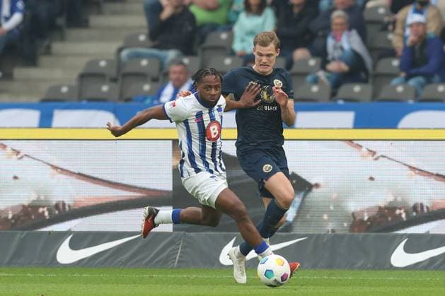 12.04.2024, xtgx, Fussball 2. Bundesliga, Hertha BSC - Hansa Rostock emspor, v.l. Deyovaisio Zeefuik (Hertha, 34), Svante Ingelsson (Rostock, 14) Zweikampf, Duell, Kampf, tackle (DFL DFB REGULATIONS PROHIBIT ANY USE OF PHOTOGRAPHS as IMAGE SEQUENCES and or QUASI-VIDEO) Berlin