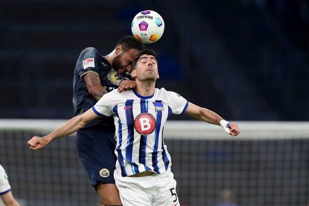 12.04.2024, xtgx, Fussball 2. Bundesliga, Hertha BSC - FC Hansa Rostock emspor, v.l. Junior Brumado (FC Hansa Rostock) Andreas Bouchalakis (Hertha BSC Berlin) Zweikampf, Aktion, action, battle for the ball (DFL DFB REGULATIONS PROHIBIT ANY USE OF PHOTOGRAPHS as IMAGE SEQUENCES and or QUASI-VIDEO) Berlin