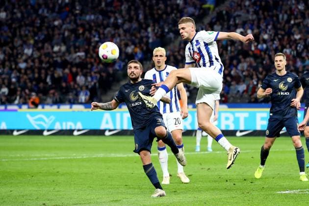 12.04.2024, xtgx, Fussball 2. Bundesliga, Hertha BSC - FC Hansa Rostock emspor, v.l. Konstantinos Stafylidis (FC Hansa Rostock) Marlon Dardai (Hertha BSC Berlin) Zweikampf, Aktion, action, battle for the ball (DFL DFB REGULATIONS PROHIBIT ANY USE OF PHOTOGRAPHS as IMAGE SEQUENCES and or QUASI-VIDEO) Berlin