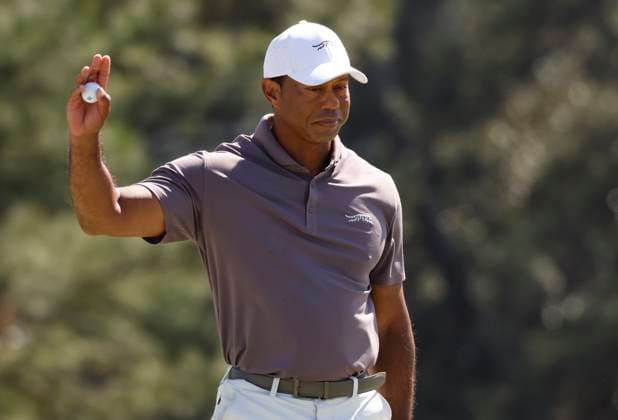 Tiger Woods waves after sinking a putt on the eighteenth green during the second round of the Masters Tournament at Augusta National Golf Club in Augusta, Georgia on Friday, April 12, 2024. Woods finished the day at one-over-par.  AUG20240412131 JOHNxANGELILLO