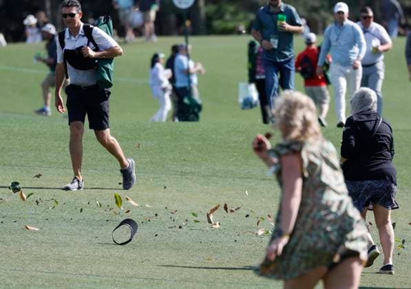 Strong winds blow debris across the course during the second round of the Masters Tournament at Augusta National Golf Club in Augusta, Georgia on Friday, April 12, 2024.  AUG20240412148 JOHNxANGELILLO