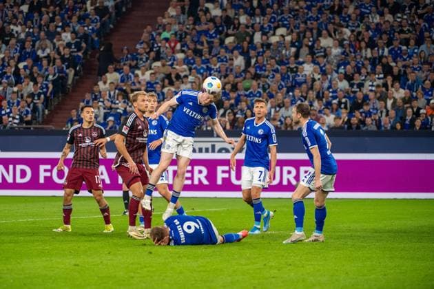 2. Fussball Bundesliga: FC Schalke 04 - 1. FC Nürnberg; 13.04.2024 Finn Jeltsch (1. FC Nürnberg, 44), Thomas Ouwejan (FC Schalke 04, 2), Simon Terodde (FC Schalke 04, 9), Derry John Murkin (FC Schalke 04, 5); 2. Fussball Bundesliga. FC Schalke 04 - 1. FC Nürnberg, 29. Spieltag, am 13.04.2024, Veltins Arena, Gelsenkirchen. DFL REGULATIONS PROHIBIT ANY USE OF PHOTOGRAPHS AS IMAGE SEQUENCES AND OR QUASI-VIDEO.