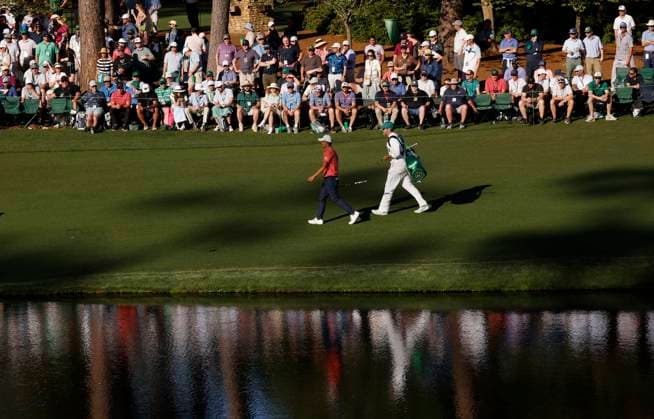 Collin Morikawa and his caddie walk to the sixteenth green during the third round of the Masters Tournament at Augusta National Golf Club in Augusta, Georgia on Saturday, April 13, 2024.  AUG20240413149 JOHNxANGELILLO