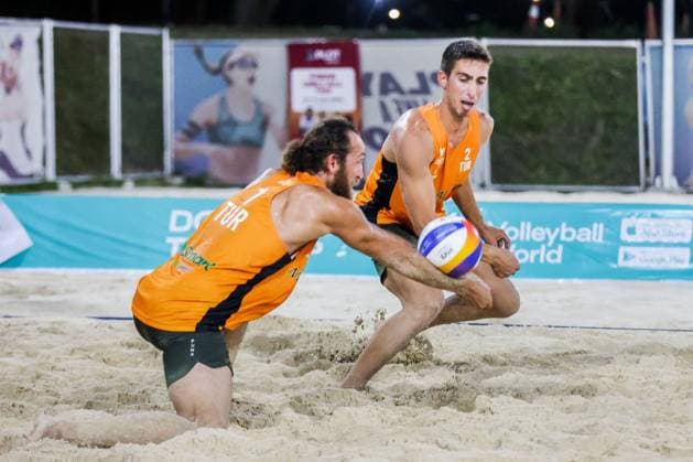 (240414) -- LAGUNA PROVINCE, April 14, 2024 -- Turkey s Hasan Huseyin Mermer (L) and Sacit Kurt (R) competes against Philipp Huster Bennet Poniewaz of Germany during the men s quarterfinals match at the Volleyball World Beach Pro Tour Futures in Laguna Province, the Philippines, April 13, 2024. ) (SP)THE PHILIPPINES-LAGUNA PROVINCE Beach volleyball, Beachvolleyball BEACH PRO TOUR FUTURES-QUARTERFINALS ROUELLExUMALI 