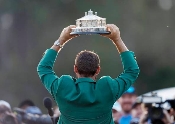 Scottie Scheffler raises his trophy after winning the Masters tournament at Augusta National Golf Club in Augusta, Georgia on Sunday, April 14, 2024. Scheffler won with a score of 11 under par.  AUG20240414173 JOHNxANGELILLO