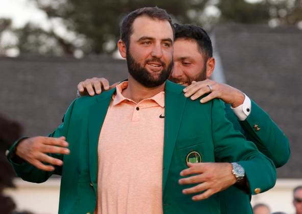 Masters winner Scottie Scheffler receives his Green Jacket from last years winner Jon Rahm after the final round of the Masters tournament at Augusta National Golf Club in Augusta, Georgia on Sunday, April 14, 2024. Scheffler won with a score of 11 under par.  AUG20240414577 TANNENxMAURY
