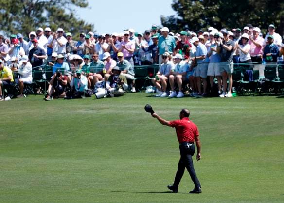 Tiger Woods tips his cap to patrons as he walks to the 18th green in the final round of the Masters Tournament at Augusta National Golf Club in Augusta, Georgia on Sunday, April 14, 2024. Woods played his 100th round at Augusta National and shot 16-over for the tourney to finish at the bottom of the leaderboard.  AUG202404141001 JOHNxANGELILLO