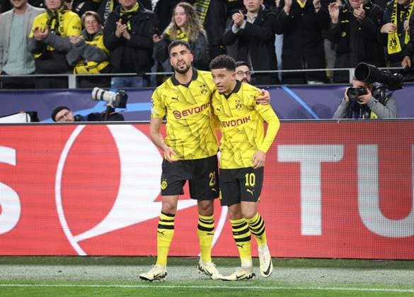 Jadon Sancho of Borussia Dortmund celebrates scoring his sides second goal with team-mate Emre Can of Borussia Dortmund Borussia Dortmund v Atletico Madrid, UEFA Champions League, Quarter Final, Second Leg, Football, Signal Iduna Park, Dortmund, Germany - 16 Apr 2024 EDITORIAL USE ONLY No use with unauthorised audio, video, data, fixture lists, club league logos or live services. Online in-match use limited to 120 images, no video emulation. No use in betting, games or single club league player publications. Copyright: xMichaelxZemanek Shutterstockx 14434932y