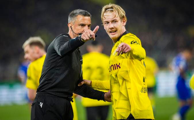 Dortmund Germany. 16th Apr 2024. Schiedsrichter Slavko Vincic und Julian Brandt (BVB) Borussia Dortmund - Atletico Madrid 16.04.2024