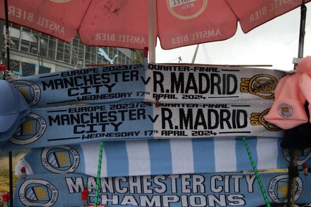 17th April 2024; Etihad Stadium, Manchester, England; Champions League Football, Quarter Final, Manchester City versus Real Madrid; match scarves on sale on the approach to the stadium  ActionPlus12631329 DavidxBlunsden