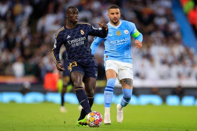 Manchester City v Real Madrid Champions League 17 04 2024. Quarter Final Ferland Mendy (23) of Real Madrid passes the ball watched by Kyle Walker (2) of Manchester City during the Champions League quarter-final second leg match between Manchester City and Real Madrid at the Etihad Stadium, Manchester, England on 17 April 2024. Manchester Etihad Stadium Manchester England Editorial use only , Copyright: xConorxMolloyx PSI-19472-0031