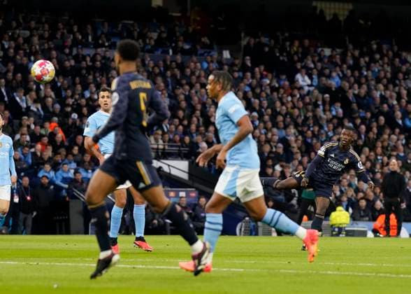 Manchester, England, 17th April 2024. Eduardo Camavinga of Real Madrid lets loose a shot on goal during the UEFA Champions League Quarter Final 2nd Leg match at the Etihad Stadium, Manchester. Picture credit should read: Andrew Yates Sportimage EDITORIAL USE ONLY. No use with unauthorised audio, video, data, fixture lists, club league logos or live services. Online in-match use limited to 120 images, no video emulation. No use in betting, games or single club league player publications. SPI-3082-0038