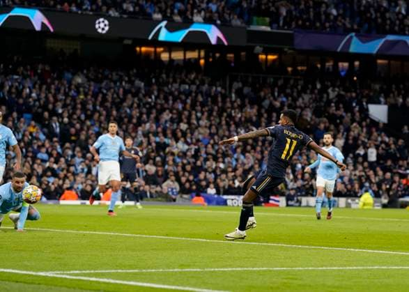 Manchester, England, 17th April 2024. Rodrygo of Real Madrid scores the first goal during the UEFA Champions League Quarter Final 2nd Leg match at the Etihad Stadium, Manchester. Picture credit should read: Andrew Yates Sportimage EDITORIAL USE ONLY. No use with unauthorised audio, video, data, fixture lists, club league logos or live services. Online in-match use limited to 120 images, no video emulation. No use in betting, games or single club league player publications. SPI-3082-0048