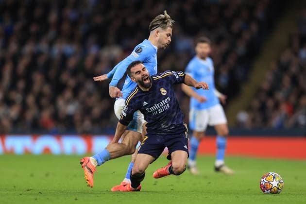 Football - UEFA Champions League - Quarter Final (2nd Leg) - Manchester City v Real Madrid 17th April 2024 - UEFA Champions League - Quarter Final (2nd Leg) - Manchester City v Real Madrid - Jack Grealish of Manchester City tackles Daniel Carvajal of Real Madrid - Photo: Simon Stacpoole Offside. Manchester UK Copyright: xSimonxStacpoolexOffside