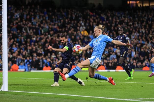 Football - UEFA Champions League - Quarter Final (2nd Leg) - Manchester City v Real Madrid 17th April 2024 - UEFA Champions League - Quarter Final (2nd Leg) - Manchester City v Real Madrid - Nacho Fernandez of Real Madrid clears the ball from Erling Haaland of Manchester City - Photo: Simon Stacpoole Offside. Manchester UK Copyright: xSimonxStacpoolexOffside