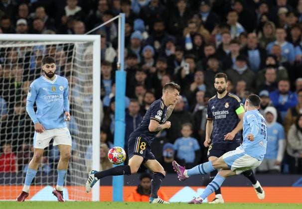17th April 2024; Etihad Stadium, Manchester, England; Champions League Football, Quarter Final, Manchester City versus Real Madrid; Phil Foden of Manchester City attempts a long range shot on goal  ActionPlus12631420 DavidxBlunsden