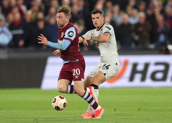 London, England, 18th April 2024. Jarrod Bowen of West Ham United challenged by Granit Xhaka of Bayer Leverkusen during the UEFA Europa League match at the London Stadium, London. Picture credit should read: David Klein Sportimage EDITORIAL USE ONLY. No use with unauthorised audio, video, data, fixture lists, club league logos or live services. Online in-match use limited to 120 images, no video emulation. No use in betting, games or single club league player publications. SPI-3091-0035