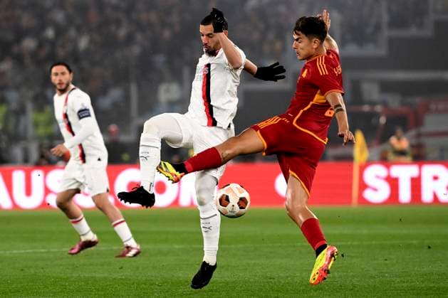 Ismael Bennacer of AC Milan and Paulo Dybala of AS Roma compete for the ball during the Europa League football match between AS Roma and AC Milan at Olimpico stadium in Rome (Italy), April 18th, 2024. AndreaxStaccioli