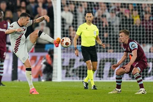 West Ham United FC v Bayer 04 Leverkusen Granit Xhaka of Bayer Leverkusen under pressure from James Ward-Prowse of West Ham United during the West Ham United FC v Bayer 04 Leverkusen UEFA Europa League Quater-Finals 2nd Leg match at London Stadium, London, England, United Kingdom on 18 April 2024 Editorial use only. All images are copyright Every Second Media Limited. No images may be reproduced without prior permission. Copyright: xIMAGO EveryxSecondxMediax ESM-0986-0123
