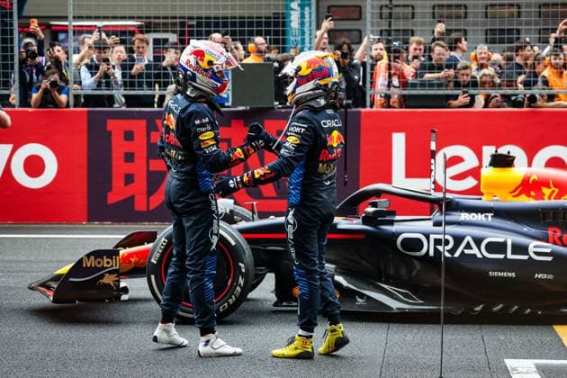 VERSTAPPEN Max (ned), Red Bull Racing RB20, portrait celebrating victory with PEREZ Sergio (mex), Red Bull Racing RB20, during the Formula 1 Lenovo Chinese Grand Prix 2024, 5th round of the 2024 Formula One World Championship, WM, Weltmeisterschaft from April 19 to 21, 2024 on the Shanghai International Circuit, in Shanghai, China - F1 - CHINESE GRAND PRIX 2024 DPPI Panoramic 240421_R05_CHINA_DP_FGOO3047