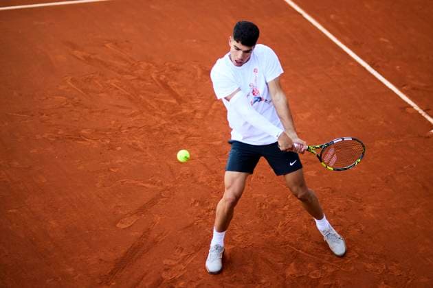 Mutua Madrid Open - Day One Carlos Alcaraz of Spain returns a shot during a training session of the day one of the Mutua Madrid Open 2024 at Caja Magica on April 22, 2024, in Madrid, Spain. Madrid Caja Magica Madrid Spain RL_MMO24_079 Copyright: xRicardoxLarreinax