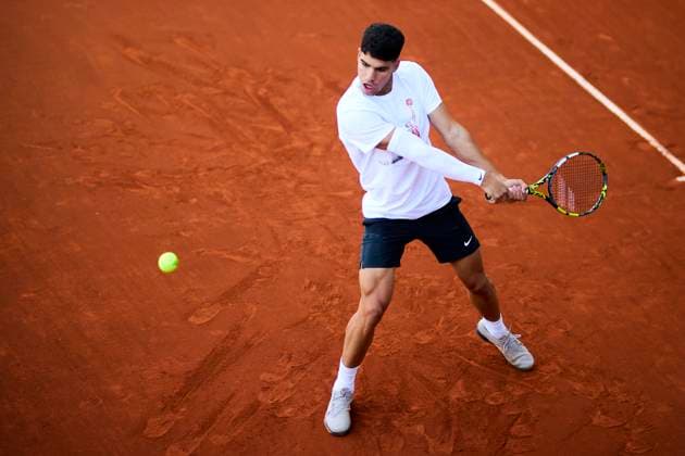 Mutua Madrid Open - Day One Carlos Alcaraz of Spain returns a shot during a training session of the day one of the Mutua Madrid Open 2024 at Caja Magica on April 22, 2024, in Madrid, Spain. Madrid Caja Magica Madrid Spain RL_MMO24_080 Copyright: xRicardoxLarreinax