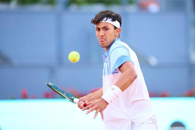 Mutua Madrid Open - Day One Emilio Nava of USA returns a shot against Benjamin Hassan of Germany during day one of the Mutua Madrid Open 2024 at Caja Magica on April 22, 2024, in Madrid, Spain. Madrid Caja Magica Madrid Spain RL_MMO24_265 Copyright: xRicardoxLarreinax