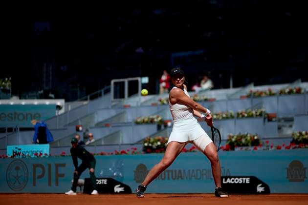Mutua Madrid Open - Day Three Paula Badosa of Spain returns a shot against Jessica Bouzas Maneiro of Spain during day three of the Mutua Madrid Open 2024 at Caja Magica on April 24, 2024, in Madrid, Spain. Madrid Caja Magica Madrid Spain RL_MMO24_551 Copyright: xRicardoxLarreinax