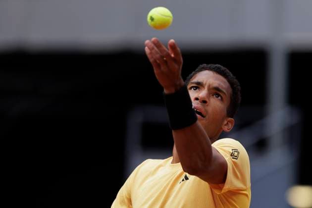 MADRID, SPAIN - APRIL 25: Felix Auger returns a shot against Yoshihito Nishioka during their match on Day 4 of the Mutua Madrid Open at Caja Magica Stadium in Madrid. ONLYxEDITORIALxUSAGE  (251218939)
