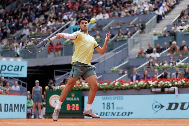 MADRID, SPAIN - APRIL 26:Carlos Alcaraz returns the ball against Alexander Shevchenko during their match on Day 5 of the Mutua Madrid Open at Caja Magica Stadium in Madrid. ONLYxEDITORIALxUSAGE  (251341784)