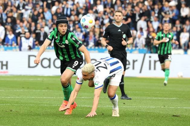 DEU, DFL, 2. FBL, Hertha BSC vs. Hannover 96, 26.04.2024, Berliner Olympiastadion, Berlin, DEU, DFL, 2. FBL, Hertha BSC vs. Hannover 96, im Bild Marc-Oliver Kempf (Hertha BSC Berlin 20), Nicolo Tresoldi (Hannover 96 9) DFL - regulations prohibit any use of Photographs as image sequences and or quasi-video Foto: Juergen Engler nordphoto GmbH