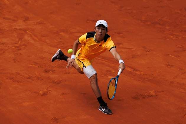 MADRID, SPAIN - APRIL 26:Juncheng Shang returns the ball against Alejandro Davidovich during their match on Day 5 of the Mutua Madrid Open at Caja Magica Stadium in Madrid. ONLYxEDITORIALxUSAGE  (251343625)