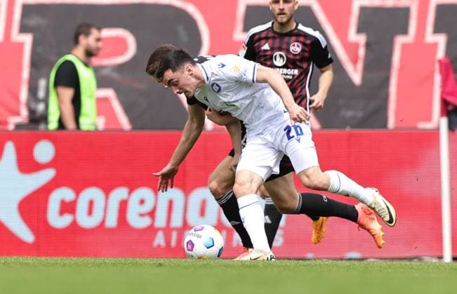 28.04.2024 - Fussball - Saison 2023 2024 - 2. Fussball - Bundesliga - 31. Spieltag: 1. FC Nürnberg FCN ( Club ) - Karlsruher SC KSC - Sportfoto Zink DaMa - xdaxmax - DFL regulations prohibit any use of photographs as image sequences and or quasi-video - only for editorial use - Florian Flick (6, 1. FC Nürnberg FCN ) Paul Nebel (26, Karlsruher SC KSC )