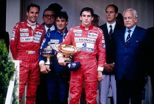RECORD DATE NOT STATED Foto LaPresse motori Gran Premio Formula 1 nella foto: Ayrton Senna con il trofeo del vincitore sul podio del Gran Premio di Monaco del 1990, insieme con il compagno di squadra Gerhard Berger in McLaren e Jean Alesi su Tyrrell. Alle loro spalle il principe Ranieri di Monaco, il figlio Alberto e il presidente della FISA Jean Marie Balestre  Copyright: xLaPressex
