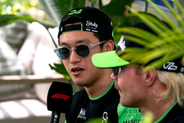 Chinese Formula One driver Guanyu Zhou of Stake F1 Team is interviewed with teammate Finnish Formula One driver Valtteri Bottas in the paddock during the Formula One Miami Grand Prix at the Miami International Autodrome in Miami Gardens, Florida on May 3, 2024.  MIA20240503408 GREGxNASH