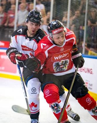 Ice hockey, Eishockey - AUT vs CAN, test match VIENNA,AUSTRIA,05.MAY.24 - ICE HOCKEY - OEEHV international test match, men, Austria vs Canada. Image shows Adam Fantilli (CAN) and Mario Huber (AUT).  GEPAxpictures xEdgarxEisner