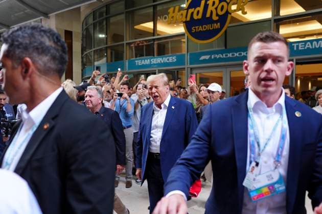 May 5, 2024, Miami, Florida, USA: Former President Donald Trump walks through the paddock on his way into the Team McLaren Formula 1 garage prior to the start of the Formula 1 Crypto.com Miami Grand Prix in Miami, Florida Miami USA - ZUMAd212 20240505_zsp_d212_001 Copyright: xRichardxDolex