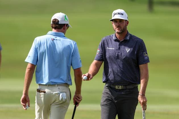 MCKINNEY, TX - MAY 05: Taylor Pendrith (CAN) waives ot the crowd as Ben Kohles (USA) goes to putt for a birdie on the 16th green during the final round of the PGA, Golf Herren CJ CUP Byron Nelson on May 5, 2024, at TPC Craig Ranch in McKinney, TX. (Photo by David Buono Icon Sportswire) GOLF: MAY 05 PGA CJ CUP Byron Nelson EDITORIAL USE ONLY Icon240505038