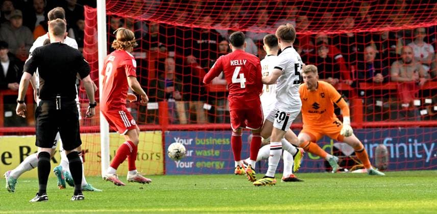 Liam Kelly of Crawley (no4) fires them into an early lead during the Sky Bet EFL League Two play-offs semi final first leg match between Crawley Town and MK Dons at the Broadfield Stadium , Crawley , UK - 7th May, 2024 Crawley Town v MK Dons League Two play-offs first leg match, Broadfield Stadium, Crawley, United Kingdom - 07 May 2024 Editorial use only. No merchandising. For Football images FA and Premier League restrictions apply inc. no internet mobile usage without FAPL license - for details contact Football Dataco  Copyright: xSimonxDack TPI Shutterstockx 14467269r