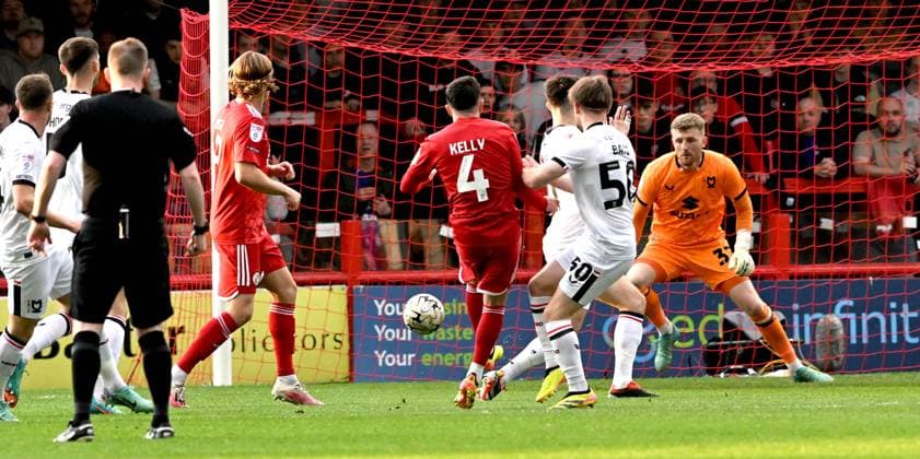 Liam Kelly of Crawley (no4) fires them into an early lead during the Sky Bet EFL League Two play-offs semi final first leg match between Crawley Town and MK Dons at the Broadfield Stadium , Crawley , UK - 7th May, 2024 Crawley Town v MK Dons League Two play-offs first leg match, Broadfield Stadium, Crawley, United Kingdom - 07 May 2024 Editorial use only. No merchandising. For Football images FA and Premier League restrictions apply inc. no internet mobile usage without FAPL license - for details contact Football Dataco  Copyright: xSimonxDack TPI Shutterstockx 14467269o