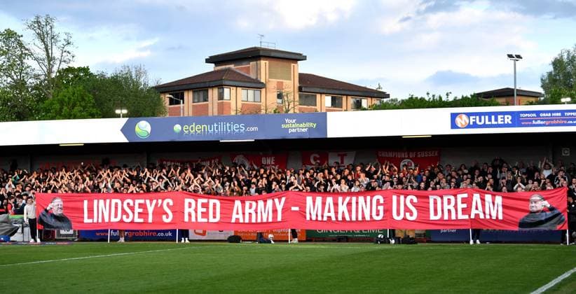 Crawley fans behind a banner of manager Scott Lindsey during the Sky Bet EFL League Two play-offs semi final first leg match between Crawley Town and MK Dons at the Broadfield Stadium , Crawley , UK - 7th May, 2024 Crawley Town v MK Dons League Two play-offs first leg match, Broadfield Stadium, Crawley, United Kingdom - 07 May 2024 Editorial use only. No merchandising. For Football images FA and Premier League restrictions apply inc. no internet mobile usage without FAPL license - for details contact Football Dataco  Copyright: xSimonxDack TPI Shutterstockx 14467269v