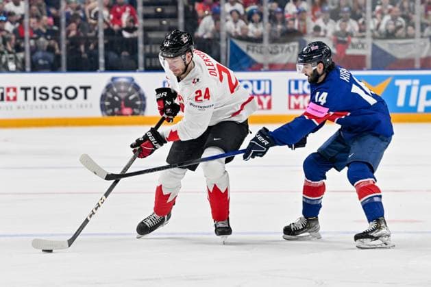 PRAGUE, CZECH REPUBLIC - MAY 11: Jamie Oleksiak of Canada (L) protects the puck against Liam Kirk of Great Britain (R) during the preliminary round match between Great Britain and Canada at Prague Arena on May 11, 2024 in Prague, Czech Republic. Prague Prague Arena Czech Republic Copyright: xJustPictures.ch AndreaxBrancax jp-en-EuSpIm-AB_11052024_AAB_4395