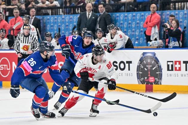 PRAGUE, CZECH REPUBLIC - MAY 11: Andrew Mangiapane of Canada protects the puck against Evan Mosey of Great Britain during the preliminary round match between Great Britain and Canada at Prague Arena on May 11, 2024 in Prague, Czech Republic. Prague Prague Arena Czech Republic Copyright: xJustPictures.ch AndreaxBrancax jp-en-EuSpIm-AB_11052024_AAB_4584